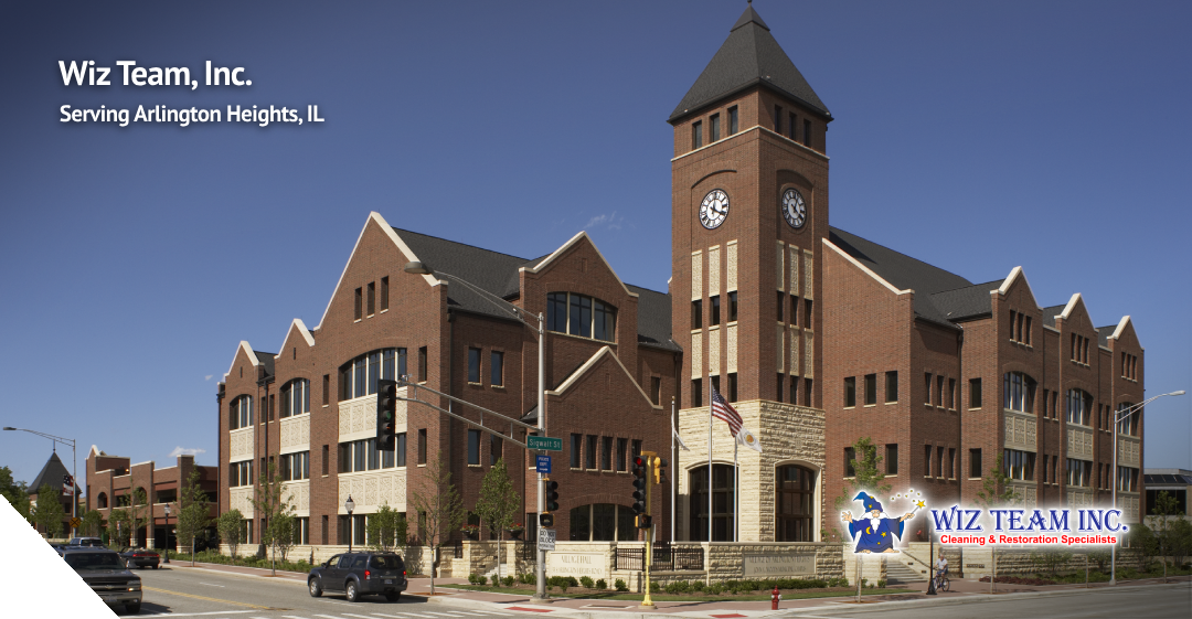 Wiz Team, Inc. building in Arlington Heights, IL, featuring a prominent clock tower and signage indicating cleaning and restoration services.