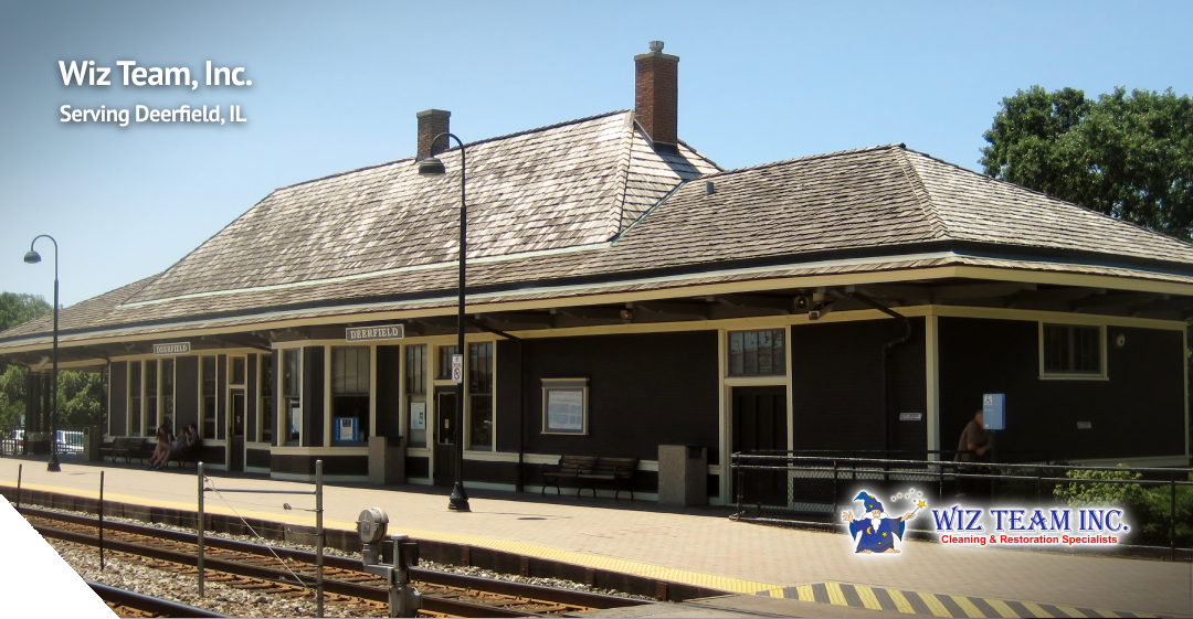 Wiz Team, Inc. logo and Deerfield train station, serving Deerfield, IL, showcasing the company's commitment to local cleaning services.