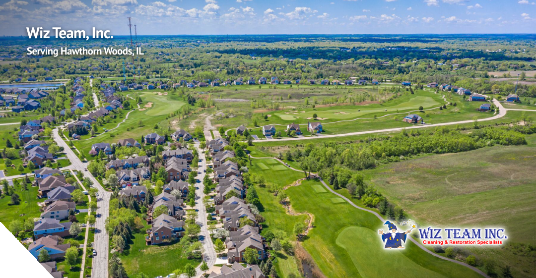 Aerial view of Hawthorn Woods, IL, showcasing residential neighborhoods, lush green spaces, and golf courses, with Wiz Team, Inc. branding highlighting local professional cleaning services.