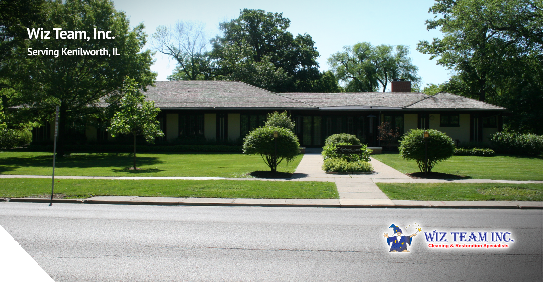 Wiz Team, Inc. building in Kenilworth, IL, surrounded by lush greenery and landscaped lawn, showcasing professional cleaning services.