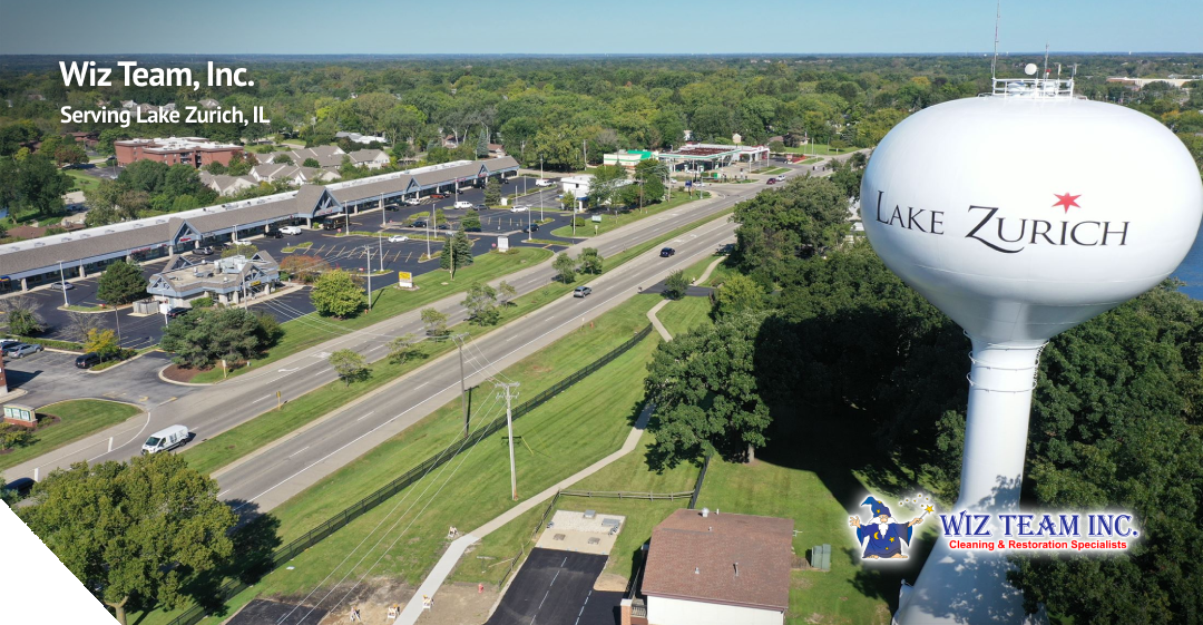 Wiz Team, Inc. logo and Lake Zurich water tower with scenic view of Lake Zurich, IL, highlighting local cleaning services and community spirit.