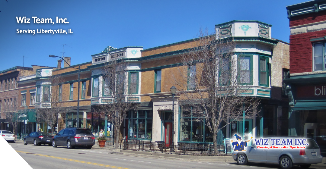 Wiz Team, Inc. storefront in Libertyville, Illinois, featuring the historic Proctor Building, emphasizing local cleaning services and community engagement.