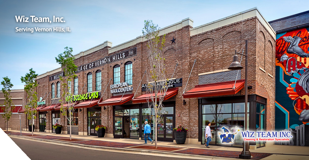 Wiz Team, Inc. storefront in Vernon Hills, IL, featuring cleaning services signage, vibrant storefronts, and a welcoming community atmosphere.