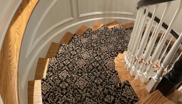 Staircase with ornate carpet runner, highlighting a clean and safe environment for homes and workplaces, emphasizing Wiz Team, Inc.'s professional carpet cleaning services.