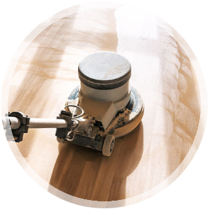 Hardwood floor cleaning machine in action, showcasing professional cleaning services offered by Wiz Team Inc.