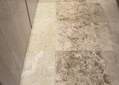 Tile floor with visible stains and discoloration, illustrating the need for professional tile and grout cleaning services by Wiz Team, Inc. in the Chicagoland area.