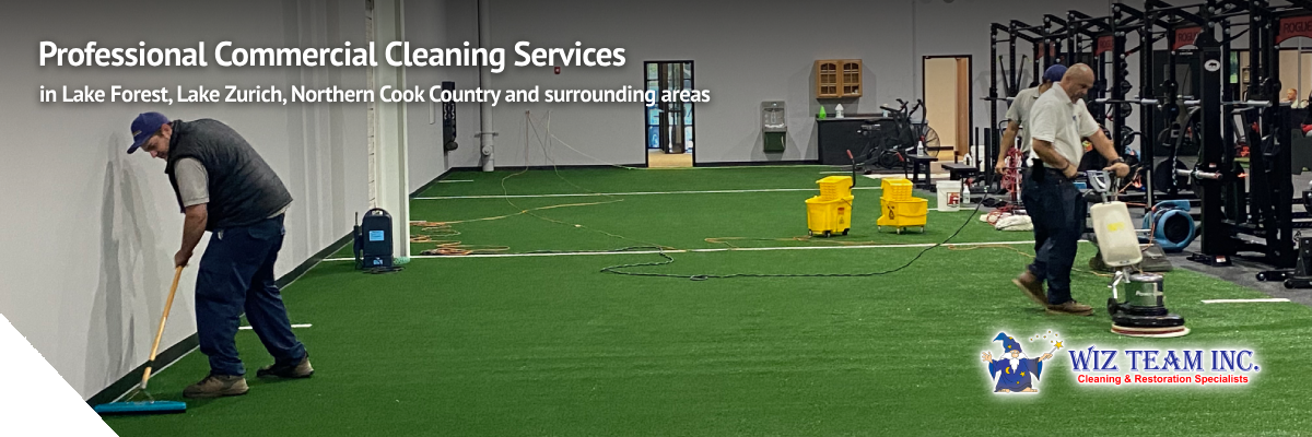 Professional commercial cleaners performing cleaning services in a gym setting with equipment and cleaning tools, emphasizing Wiz Team Inc.'s commitment to maintaining a clean and healthy workspace in Lake Forest, IL.