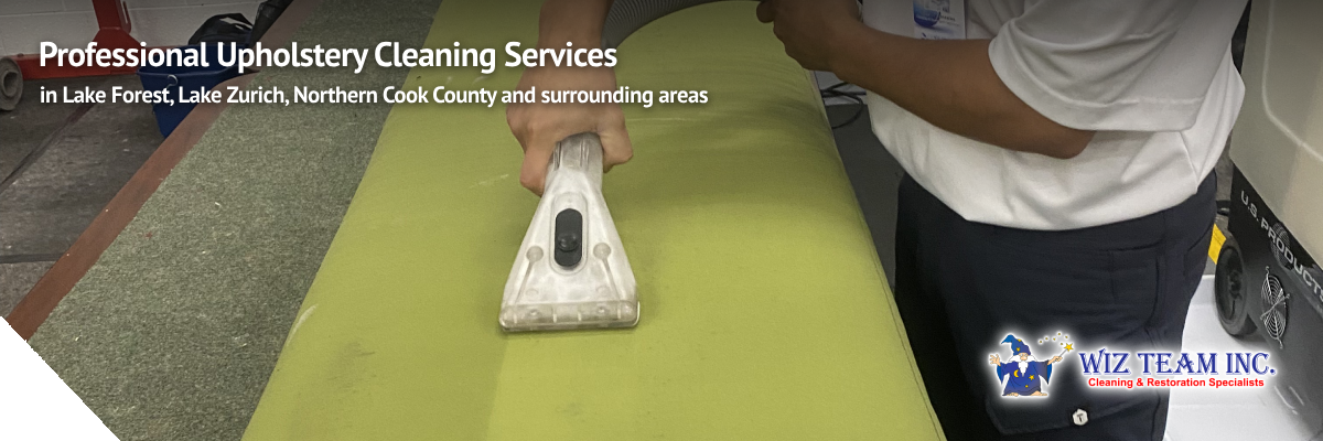 Professional upholstery cleaning service in action, technician using equipment on green fabric, promoting Wiz Team Inc. services in Lake Forest and surrounding areas.