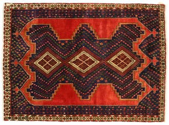 Afshar Persian rug featuring intricate geometric patterns in rich red and dark blue tones, highlighting traditional tribal craftsmanship.