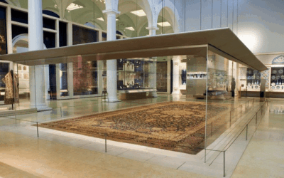 Persian Ardabil carpet displayed in a modern museum setting, showcasing its intricate design and historical significance in carpet cleaning and home décor.