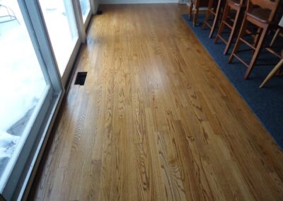 Hardwood floor cleaning by Wiz Team, using eco-friendly products and techniques in Lake Forest, IL.