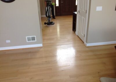 Hardwood floor cleaning by Wiz Team, Inc. in Lake Forest, using eco-friendly techniques.